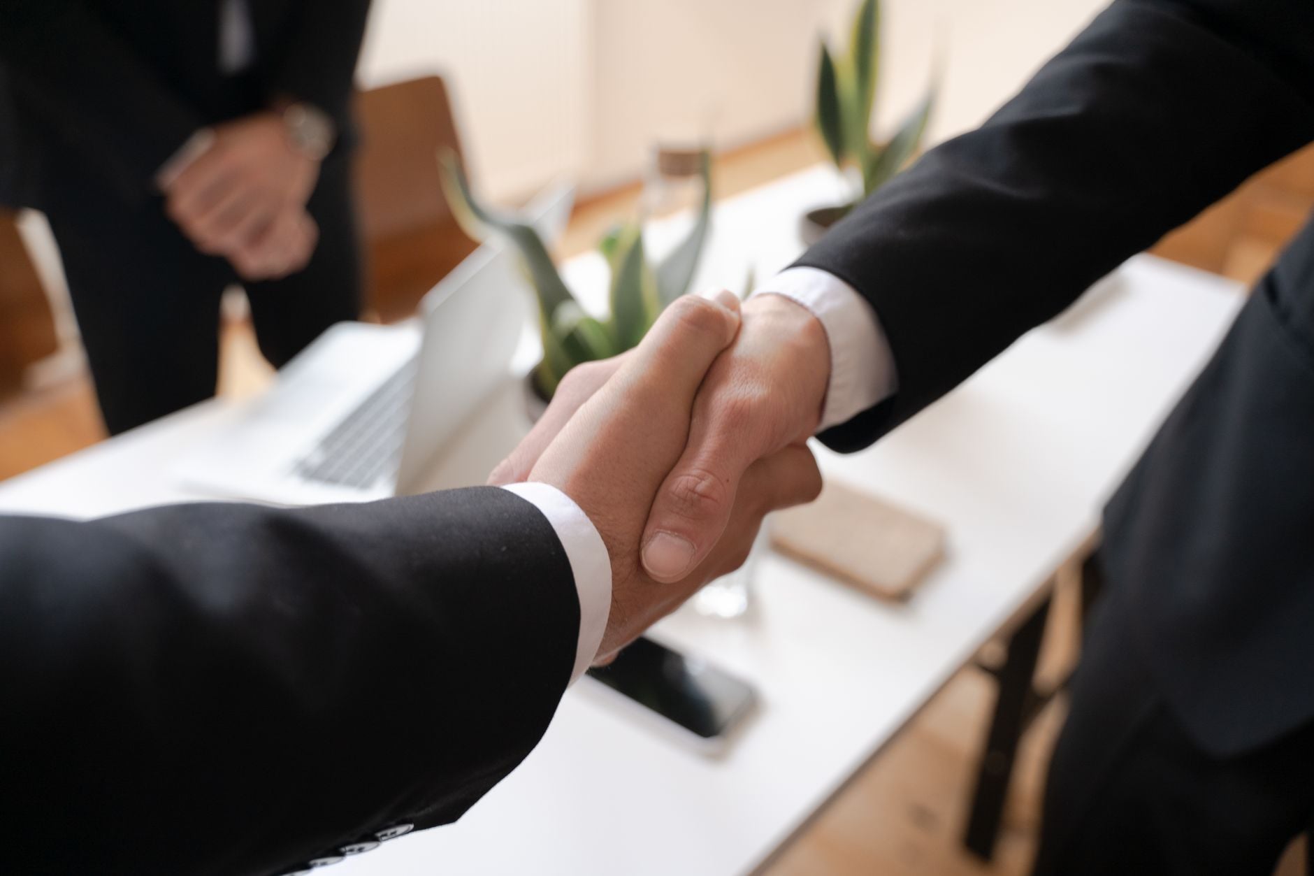 Business professionals discussing compensation and pay transparency in an Indiana workplace